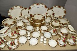 A ROYAL ALBERT 'OLD COUNTRY ROSES' TWELVE PIECE DINNER SETTING, to include teapot, coffee pot, milk,