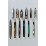 A COLLECTION OF SIX VINTAGE FOUNTAIN PENS including a Moore 94A in striped golden brown with a