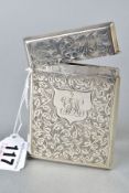 A LATE VICTORIAN SILVER CARD CASE, rectangular outline, foliate scrolled decoration, shield