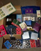 A LARGE BOX AND TUB OF COINS AND COMMEMORATIVES to include fourteen proof United Kingdom year sets