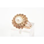 A CULTURED PEARL RING, of a tiered floral design set with a single central cultured pearl, ring size