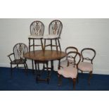 AN OAK BARLEY TWIST DROP LEAF TABLE and three wheel back chairs together with three Victorian chairs