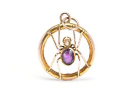 A GEM SET SPIDER PENDANT, of circular outline with central openwork spider detail, the spider with