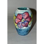 A MOORCROFT POTTERY VASE 'Anemone' pattern on blue ground, Queen Mary paper label to base, height