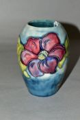 A MOORCROFT POTTERY VASE 'Anemone' pattern on blue ground, Queen Mary paper label to base, height