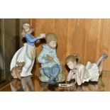 THREE NAO FIGURES, comprising Ballerina, pensive, length 22.5cm, a boy sitting with rabbit and