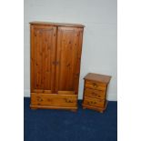 A MODERN PINE DOUBLE DOOR CHILD'S WARDROBE, with a single long drawer and a matching three drawer