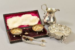 A GROUP OF SILVER, comprising a late Victorian bon bon dish, repousse decorated on four cast