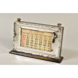 A GEORGE V STYLE MOUNTED PERPETUAL CALENDAR, of rectangular form, wavy edge to the frame, bears