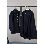 A BRITISH POLICE OFFICERS CAPE, heavy wool complete with chain fastening and a British Fire Officers