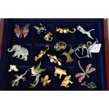 A SELECTION OF COSTUME JEWELLERY BROOCHES, to include various animal designs, an elephant set with