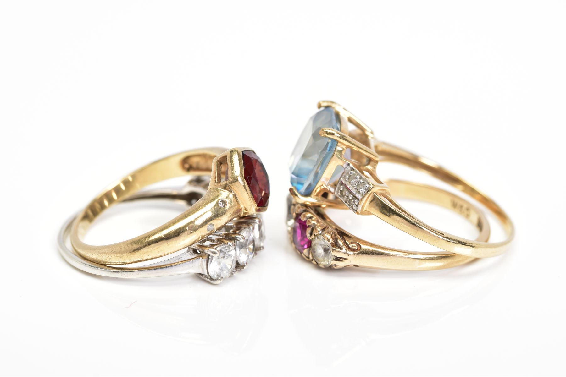 FOUR 9CT GOLD GEM SET RINGS, the first collet set with a central hexagonal garnet and flush set with - Image 2 of 4