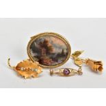 A SELECTION OF FOUR BROOCHES, to include a large yellow metal oval panel depicting a shrine and lady
