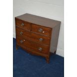A GEORGIAN MAHOGANY AND STRUNG CHEST OF TWO SHORT AND THREE LONG DRAWERS on splayed bracket feet,