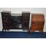 AN EDWARDIAN MAHOGANY FOLIATE DECORATED SIDE UNIT with two short drawers above glazed cupboard doors