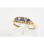 AN EARLY 20TH CENTURY 18CT GOLD SAPPHIRE AND DIAMOND RING, designed as a graduated line of three