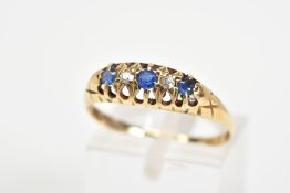 AN EARLY 20TH CENTURY 18CT GOLD SAPPHIRE AND DIAMOND RING, designed as a graduated line of three