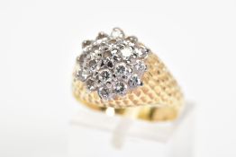 A DIAMOND DRESS RING, designed as a three tiered cluster of brilliant cut diamonds to the textured