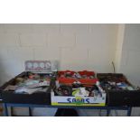 FIVE TRAYS CONTAINING VINTAGE CAR PARTS and consumables including Distributor Caps, gaskets,