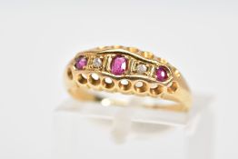 AN EARLY 20TH CENTURY 18CT GOLD RUBY AND DIAMOND RING, the boat shaped top panel set with a line