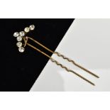 A PASTE HAIR PIN, the hinged head of curved design set with colourless paste, length 94mm