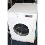 A JOHN LEWIS 8KG WASHING MACHINE/DRYER, (losses, front bottom corner) (PAT test passed)