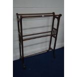 AN EDWARDIAN MAHOGANY TOWEL RAIL