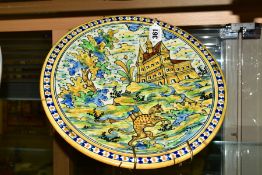 A 19TH CENTURY MAIOLICA CHARGER, painted with a border of blue and yellow dots, the centre with a