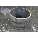 A HALF WHISKEY BARREL PLANTER, height 43cm