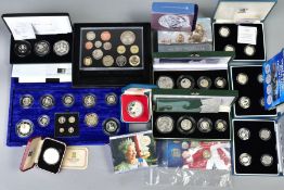 A CARDBOARD BOX CONTAINING UK ROYAL MINT COIN PROOF SETS to include two three cased one pound silver