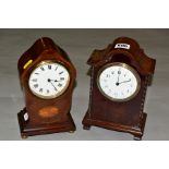 TWO EDWARDIAN MAHOGANY MANTEL CLOCKS, both with wavy domes and white enamel dials, one with inlaid