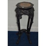 A CHINESE HARDWOOD OCTAGONAL JARDINIERE STAND, with a veined marble inset on four shaped legs united