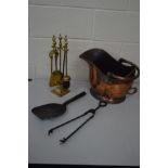 A 19TH CENTURY COPPER COAL BUCKET, together with a brass four piece companion set with stand and
