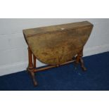 A LATE 19TH CENTURY BURR WALNUT OVAL TOPPED SUTHERLAND TABLE on twin fluted legs and turned