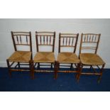 A SET OF THREE EARLY 19TH CENTURY FRUITWOOD RUSH SEATED CHAIRS with turned spindled backs together
