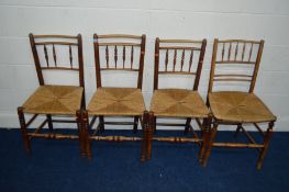 A SET OF THREE EARLY 19TH CENTURY FRUITWOOD RUSH SEATED CHAIRS with turned spindled backs together