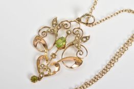 A PERIDOT AND SPLIT PEARL PENDANT AND CHAIN, the pendant of openwork scrolling foliate design set