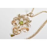 A PERIDOT AND SPLIT PEARL PENDANT AND CHAIN, the pendant of openwork scrolling foliate design set