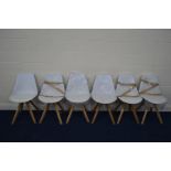 A SET OF SIX MODERN WHITE FRAMED DINING CHAIRS on a beech frame