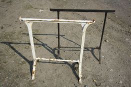 TWO VINTAGE CAST IRON TRESTLES of two different designs, 78cm and 79cm wide x both 72cm high