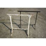 TWO VINTAGE CAST IRON TRESTLES of two different designs, 78cm and 79cm wide x both 72cm high