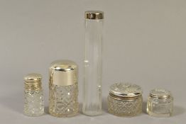 FOUR EARLY 20TH CENTURY SILVER TOPPED GLASS TOILET JARS, two cylindrical and two circular, including