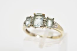 A 9CT WHITE GOLD GEM SET RING, designed as three graduated rectangular blue gems, assessed as blue