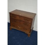 A GEORGIAN OAK CHEST OF THREE LONG DRAWERS with brass swan neck handles (one missing), on bracket