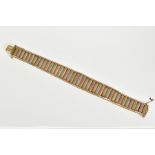 A 9CT GOLD TRI COLOURED BRICK LINK AND HERRINGBONE DESIGN BRACELET, slightly tapered ends,