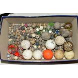 A QUANTITY OF ASSORTED MARBLES, mainly stone with some glass examples and a number of golf balls