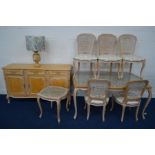 A MODERN BLEACHED WOOD FRENCH DINING SUITE, with wicker work decoration, comprising a serpentine