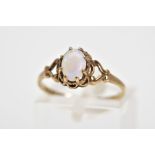 A 9CT GOLD OPAL RING, designed as an oval cabochon opal within an eight claw scalloped surround to