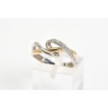 A BI-COLOUR DIAMOND DRESS RING, of asymmetrical design set with a line of single cut diamonds,