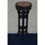 A CHINESE ROSEWOOD WAVY TOPPED JARDINIERE STAND with a veined marble inset on triple legs united